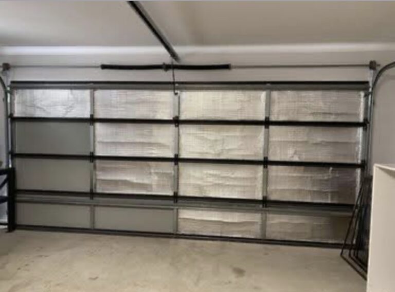 Reflective foil insulation sagging on sectional garage door interior