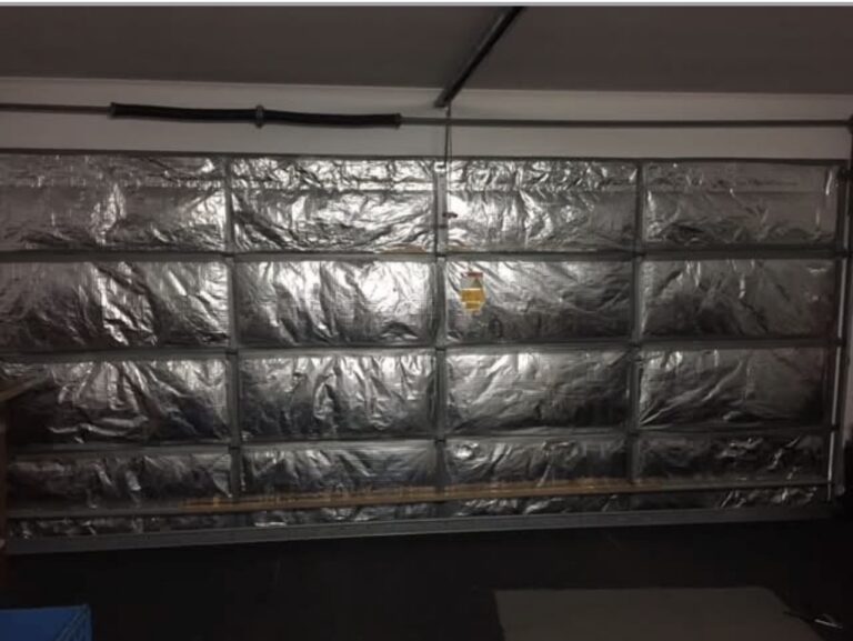 Cheap bubble foil insulation on sectional garage door prior to removal
