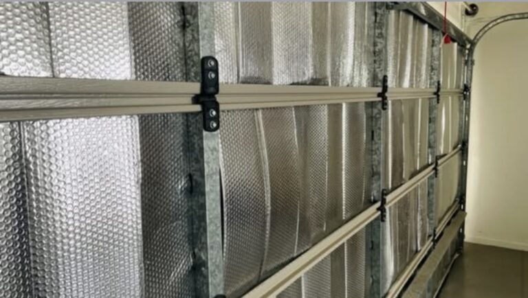 Failed foil insulation covering tilt garage door, no air gap, no thermal performance