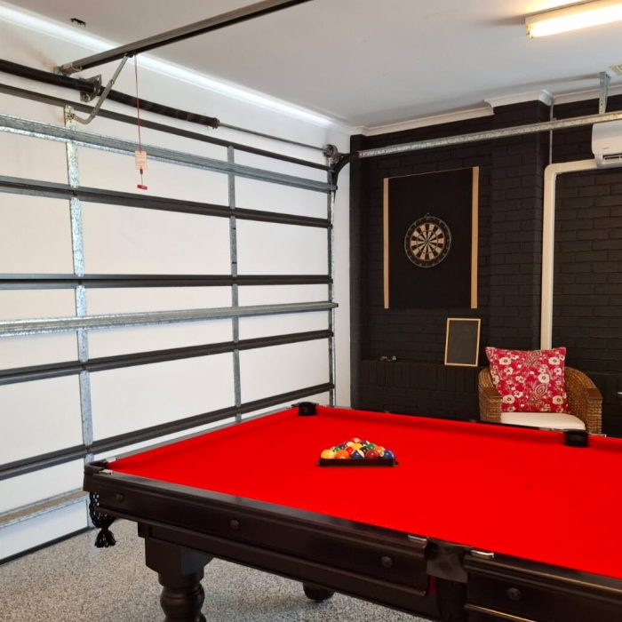 ThermaDoor garage door insulation installed in an Australian home, showing a fully insulated sectional garage door integrated into a comfortable living space